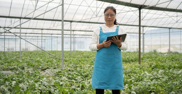 A-farmer-analyzing-increased-crop-yield-due-t0-precision-agriculture-in-Singapore