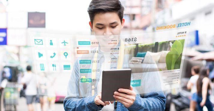 Asian-tourist-using-mobile-application-technology-booking- hotel-online
