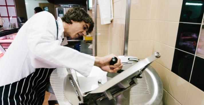 staff using meat slicer