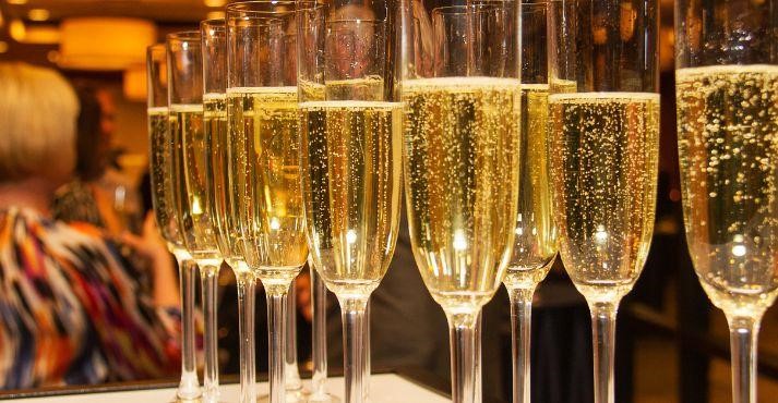 Champagne-in-lined-up-wine-glasses Champagne-in-lined-up-wine-glasses