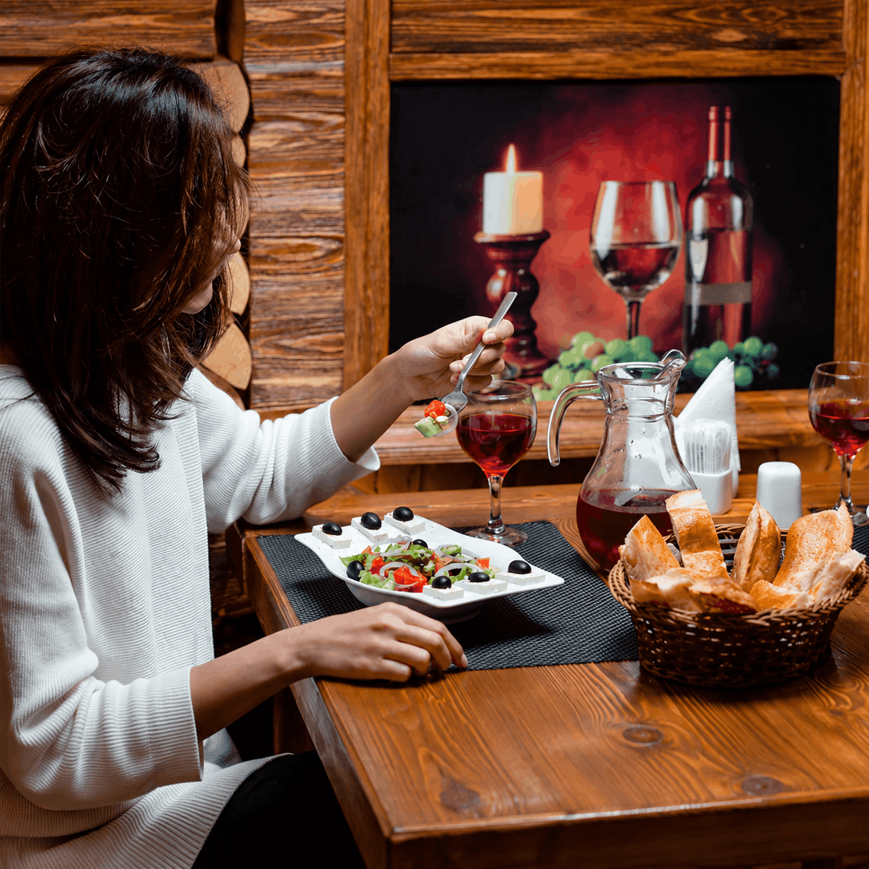 Warm dinner table with Greek salad