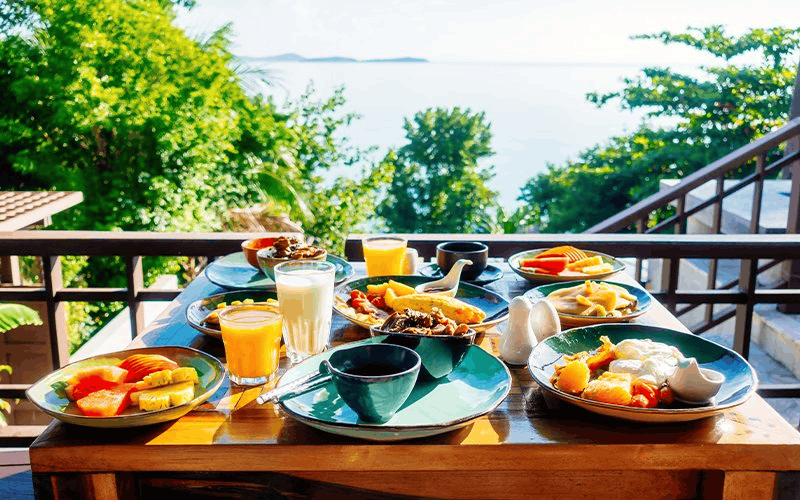 Breakfast on a balcony overlooking the sea