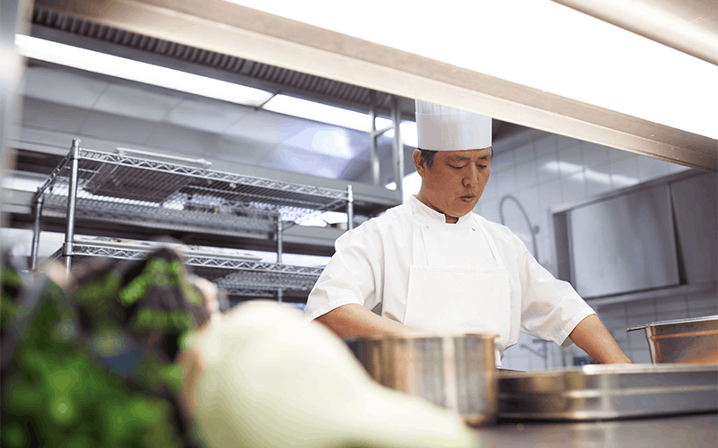 Chef preparing food in a commercial kitchen